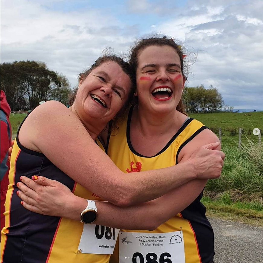 Karen and Anna hugging at a relay
